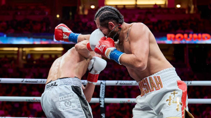 Nate Diaz scores a punch on Jorge Masvidal during their boxing match.