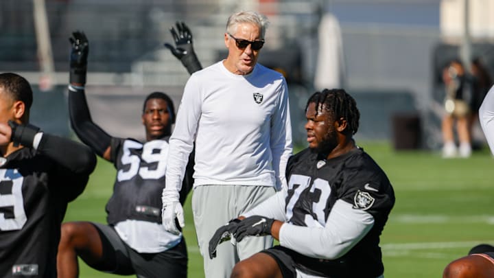 Raiders coach Pete Carroll and DT Tank Booker