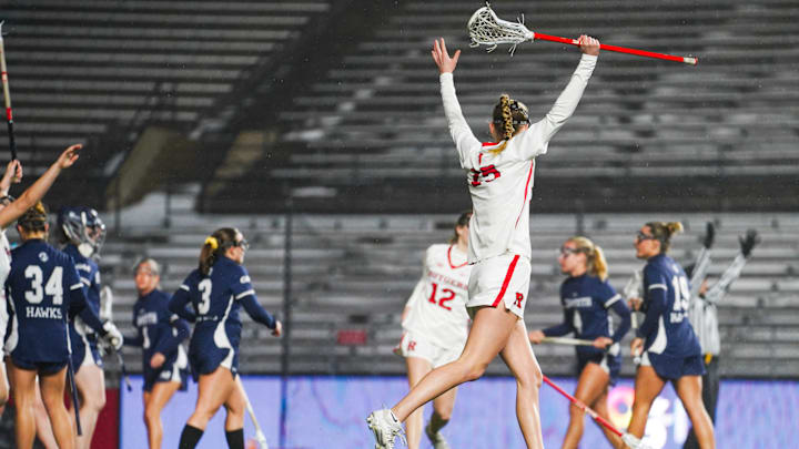 Rutgers Women's lacrosse celebrates a goal. 