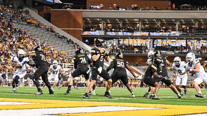 QB Ethan Hampton dropping back against UCONN. 