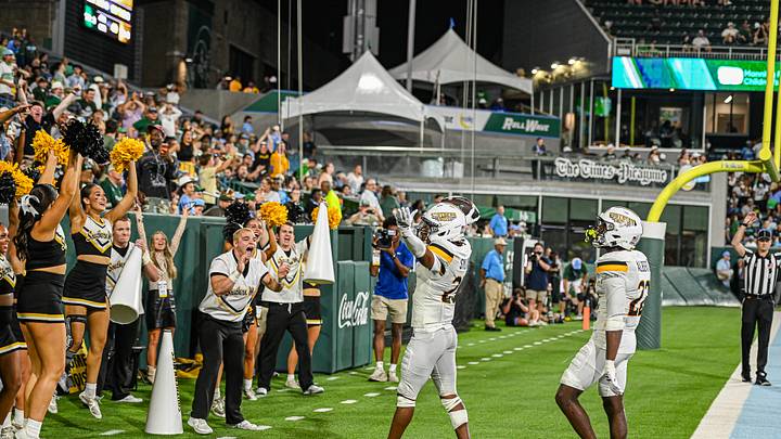 Southern Miss Defense celebrating a turnover in the end zone. Southern Miss Defense celebrating a turnover in the end zone.