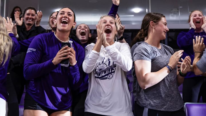 Northwestern softball players celebrate after receiving an invitation to the NCAA Tournament on May 11, 2025.