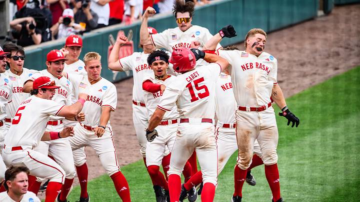 The Huskers celebrate Dylan Carey's homerun. The Huskers celebrate Dylan Carey's homerun.