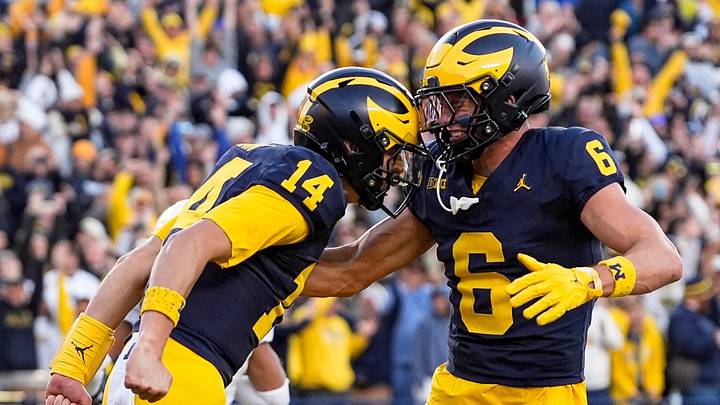 Michigan quarterback Tommy Carr (14), left, celebrates a first down against Penn State with wide receiver JJ Buchanan (6) during the second half at Michigan Stadium in Ann Arbor on Saturday, Oct. 17, 2026.