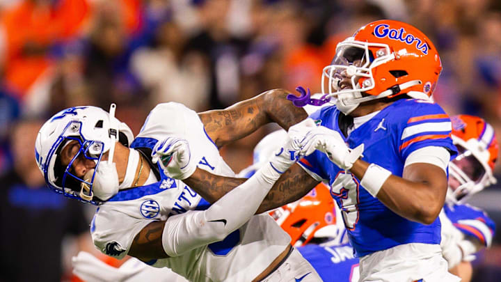 Kentucky Wildcats wide receiver Dane Key (6) and Florida Gators defensive back Jason Marshall Jr. (3) go at it during a play during the first half at Ben Hill Griffin Stadium in Gainesville, FL on Saturday, October 19, 2024 against the Kentucky Wildcats. [Doug Engle/Gainesville Sun]