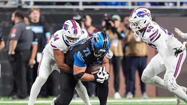 Detroit Lions guard Kevin Zeitler recovers a fumble by quarterback Jared Goff (not pictured) against Buffalo Bills defensive end Dawuane Smoot (94) during the first half at Ford Field in Detroit on Sunday, Dec. 15, 2024. Detroit Lions guard Kevin Zeitler recovers a fumble by quarterback Jared Goff (not pictured) against Buffalo Bills defensive end Dawuane Smoot (94) during the first half at Ford Field in Detroit on Sunday, Dec. 15, 2024.