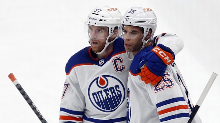 Edmonton Oilers center Connor McDavid (left) and defenseman Darnell Nurse (25) after Nurse scored a goal against the Pittsburgh Penguins during the third period at PPG Paints Arena. The Oilers won 4-0. Mandatory Credit: Charles LeClaire-Imagn Images