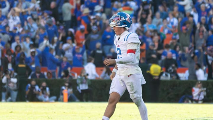 Nov 23, 2024; Gainesville, Florida, USA; Mississippi Rebels quarterback Jaxson Dart (2) walks off the field after throwing an interception against the Florida Gators during the second half at Ben Hill Griffin Stadium. Mandatory Credit: Matt Pendleton-Imagn Images