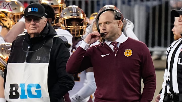 Nov 18, 2023; Columbus, Ohio, USA; Minnesota Golden Gophers head coach P. J. Fleck talks in his headset during the NCAA football game against the Ohio State Buckeyes at Ohio Stadium.
