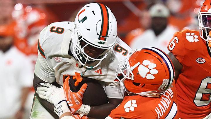 Oct 3, 2026; Clemson, South Carolina, USA; Miami Hurricanes tight end Elija Lofton (9) attempts to elude a tackle during the third quarter against the Clemson Tigers at Memorial Stadium. Mandatory Credit: Ashley Tumlin-Imagn Images Oct 3, 2026; Clemson, South Carolina, USA; Miami Hurricanes tight end Elija Lofton (9) attempts to elude a tackle during the third quarter against the Clemson Tigers at Memorial Stadium. Mandatory Credit: Ashley Tumlin-Imagn Images