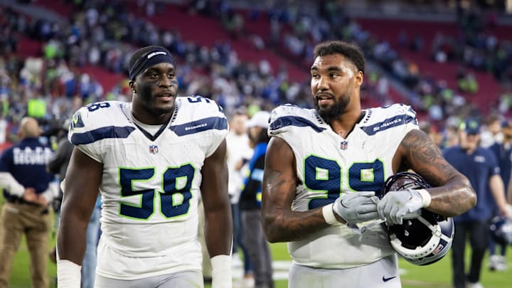 Dec 8, 2024; Glendale, Arizona, USA; Seattle Seahawks linebacker Derick Hall (58) and defensive end Leonard Williams (99) against the Arizona Cardinals at State Farm Stadium. 