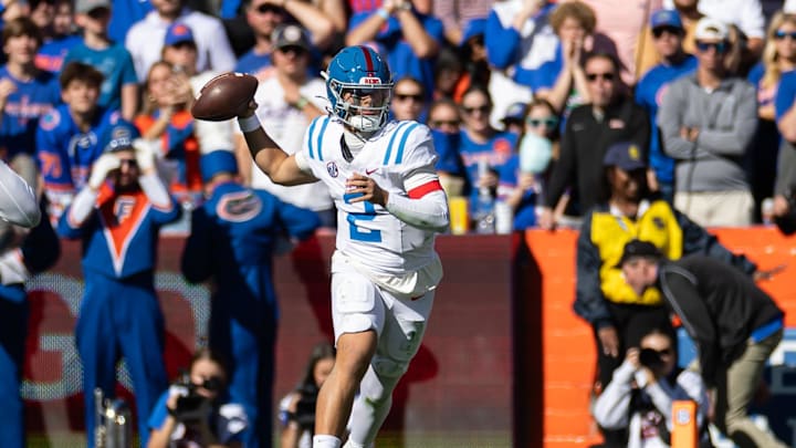 Nov 23, 2024; Gainesville, Florida, USA; Mississippi Rebels quarterback Jaxson Dart (2) throws the ball against the Florida Gators during the first half at Ben Hill Griffin Stadium. Mandatory Credit: Matt Pendleton-Imagn Images