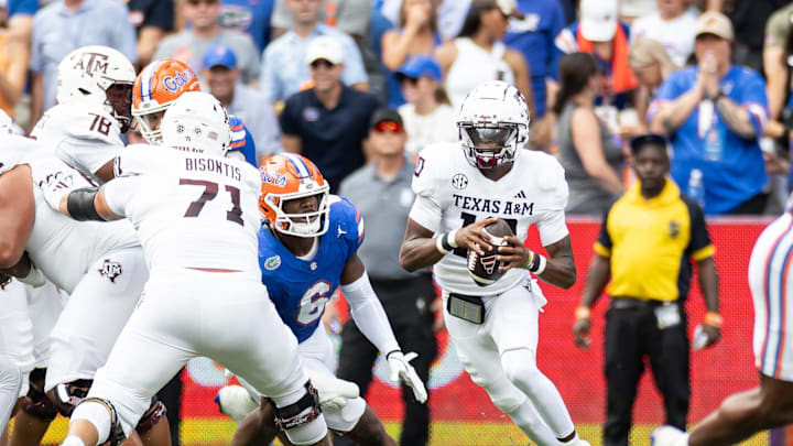 Sep 14, 2024; Gainesville, Florida, USA; Texas A&M Aggies quarterback Marcel Reed (10) scrambles with the ball past Florida Gators linebacker Shemar James (6) during the first half at Ben Hill Griffin Stadium. Mandatory Credit: Matt Pendleton-Imagn Images Sep 14, 2024; Gainesville, Florida, USA; Texas A&M Aggies quarterback Marcel Reed (10) scrambles with the ball past Florida Gators linebacker Shemar James (6) during the first half at Ben Hill Griffin Stadium. Mandatory Credit: Matt Pendleton-Imagn Images