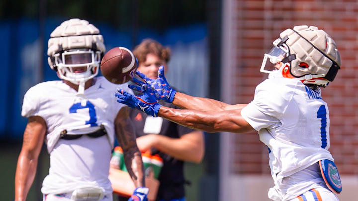 Florida Gators wide receiver Aidan Mizell (11) stretches for a catch while running pass routes during Fall practice at Sanders Practice Fields in Gainesville, FL on Thursday, August 8, 2024. [Doug Engle/Gainesville Sun]