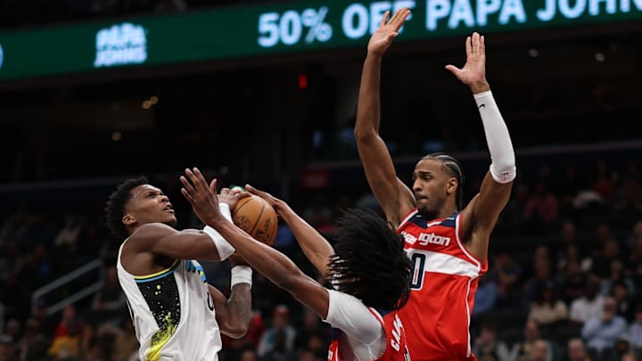 Feb 12, 2025; Washington, District of Columbia, USA; Washington Wizards forward Kyshawn George (18) strips the ball from Indiana Pacers guard Bennedict Mathurin (00) in the fourth quarter at Capital One Arena. Mandatory Credit: Geoff Burke-Imagn Images