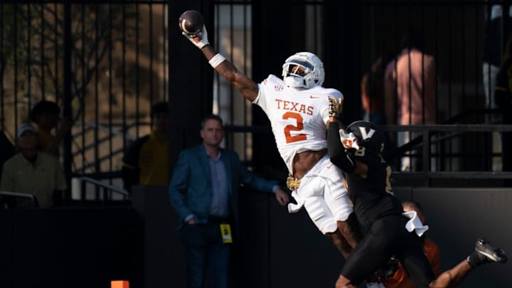Texas Longhorns wide receiver Matthew Golden (2) hauls in a touchdown against Vanderbilt Commodores cornerback Tyson Russell.