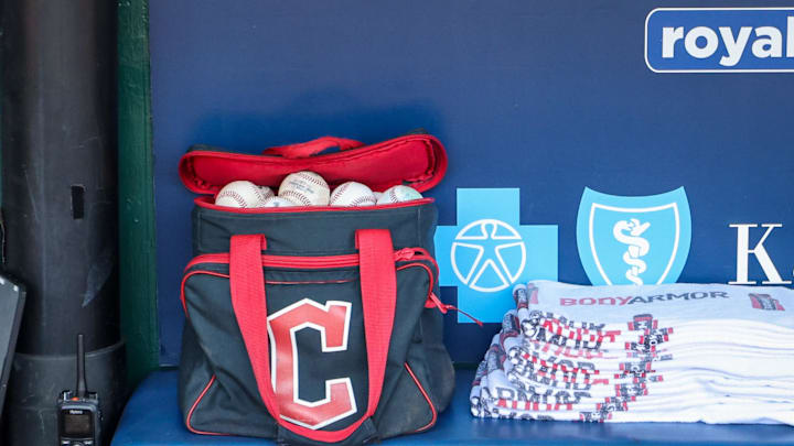 Jun 30, 2024; Kansas City, Missouri, USA; Cleveland Guardians ball bag sits in the dugout prior to the game against the Kansas City Royals at Kauffman Stadium. Mandatory Credit: William Purnell-Imagn Images