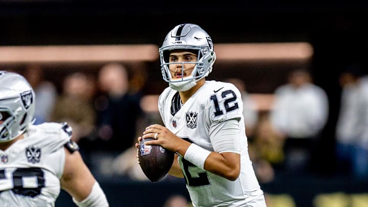 Dec 29, 2024; New Orleans, Louisiana, USA;  Las Vegas Raiders quarterback Aidan O'Connell (12) looks on against the New Orleans Saints during the second half at Caesars Superdome. Mandatory Credit: Stephen Lew-Imagn Images