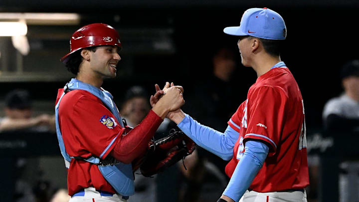 Dayton catcher Nolan Watson celebrates with pitcher Nick Wissman after the team's 8-5 win against Vanderbilt in an NCAA college baseball game Tuesday, Feb. 20, 2024, in Nashville, Tenn.
