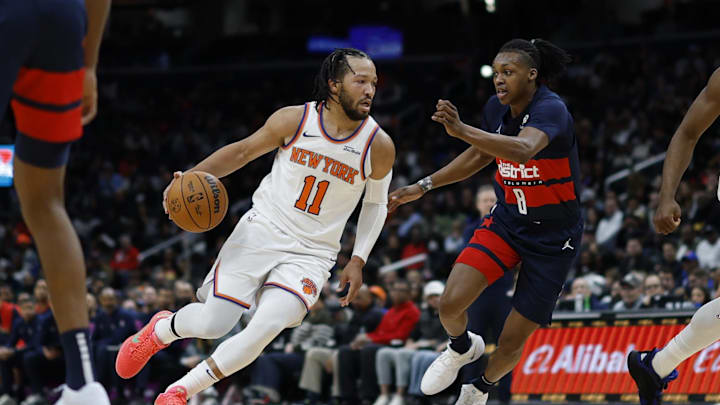 Dec 28, 2024; Washington, District of Columbia, USA; New York Knicks guard Jalen Brunson (11) drives to the basket as Washington Wizards guard Bub Carrington (8) defends in the first quarter at Capital One Arena. Mandatory Credit: Geoff Burke-Imagn Images