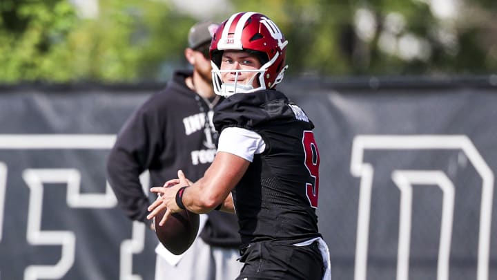 Indiana quarterback Tanner Rourke looks downfield for his option during a practice on July 31, 2024. Indiana quarterback Tanner Rourke looks downfield for his option during a practice on July 31, 2024.