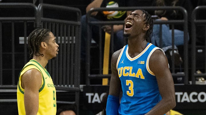 Oregon’s Keeshawn Barthelemy watches as UCLA’s Eric Dailey Jr. celebrates a play against the Ducks during the second half.