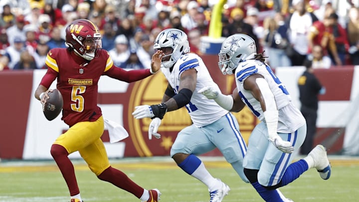Washington Commanders QB Jayden Daniels scrambles from Dallas Cowboys LB Micah Parsons and DT Osa Odighizuwa. Washington Commanders QB Jayden Daniels scrambles from Dallas Cowboys LB Micah Parsons and DT Osa Odighizuwa.