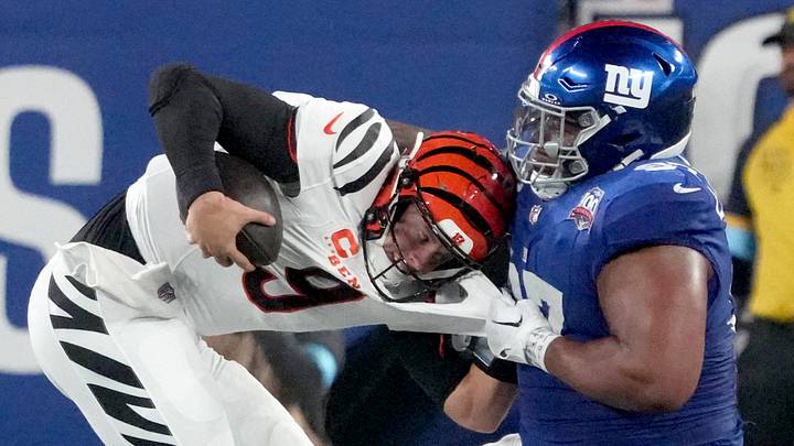 Oct 13, 2024; East Rutherford, New Jersey, USA; Cincinnati Bengals quarterback Joe Burrow (9) is sacked by New York Giants defensive tackle Dexter Lawrence II (97) in the 3rd quarter at MetLife Stadium. Mandatory Credit: Robert Deutsch-Imagn Images Oct 13, 2024; East Rutherford, New Jersey, USA; Cincinnati Bengals quarterback Joe Burrow (9) is sacked by New York Giants defensive tackle Dexter Lawrence II (97) in the 3rd quarter at MetLife Stadium. Mandatory Credit: Robert Deutsch-Imagn Images