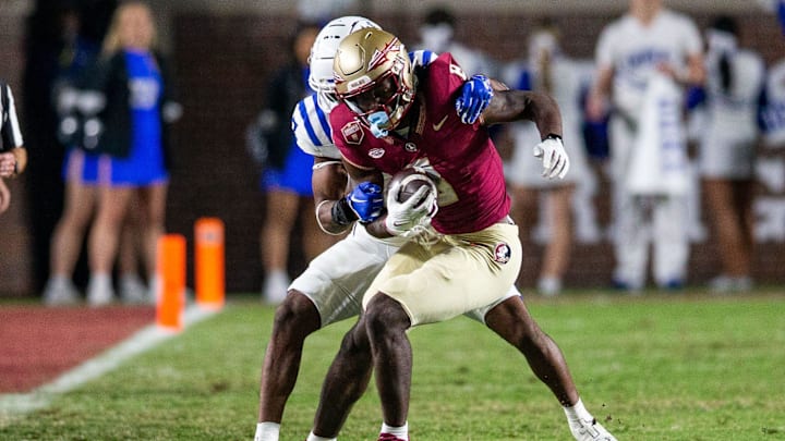 Florida State Seminoles wide receiver Hykeem Williams (8) tries to fight off a tackle. The Florida State Seminoles defeated the Duke Blue Devils 38-20 on Saturday, Oct. 21, 2023.