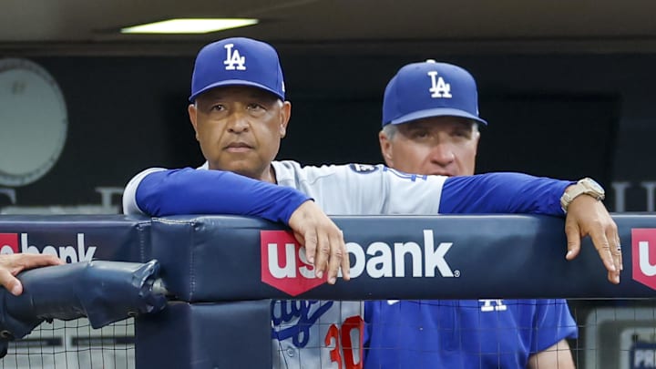 Aug 22, 2025; San Diego, California, USA; Los Angeles Dodgers manager Dave Roberts (30) watches play during the second inning against the San Diego Padres at Petco Park. Mandatory Credit: David Frerker-Imagn Images