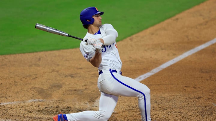 Florida utility Jac Caglianone (14) swings at a pitch during the sixth inning of an NCAA baseball matchup at 121 Financial Ballpark in Jacksonville, Fla. Florida State defeated Florida 14-3.