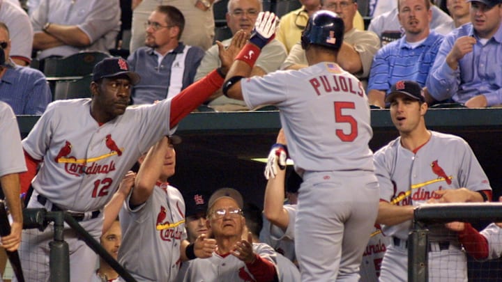 St. Louis Cardinals' Albert Pujols (5) is congratu