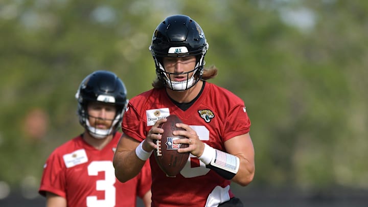 Jacksonville Jaguars quarterback Trevor Lawrence (16) runs drills as quarterback C.J. Beathard (3) looks on during the fifth day of the NFL football training camp practice session Monday, July 29, 2024 at EverBank Stadium's Miller Electric Center in Jacksonville, Fla..