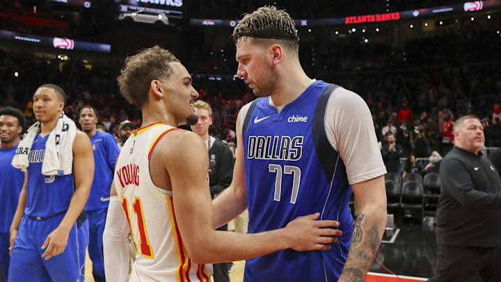 Jan 26, 2024; Atlanta, Georgia, USA; Atlanta Hawks guard Trae Young (11) talks to Dallas Mavericks guard Luka Doncic (77) after a game at State Farm Arena. Mandatory Credit: Brett Davis-Imagn Images