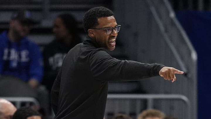 Mar 12, 2026; Charlotte, NC, USA; Miami (FL) Hurricanes head coach Jai Lucas points to a player position during the second half against the Louisville Cardinals at Spectrum Center. Mandatory Credit: Jim Dedmon-Imagn Images