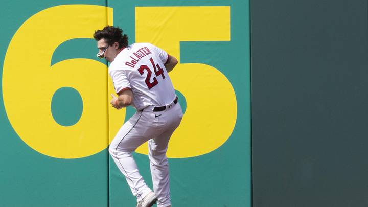 Jun 13, 2026; Cleveland, Ohio, USA; Cleveland Guardians right fielder Chase DeLauter (24) loses control of the ball as he crashes into the wall at the warning track during the first inning against the Detroit Tigers at Progressive Field. Mandatory Credit: Scott Galvin-Imagn Images