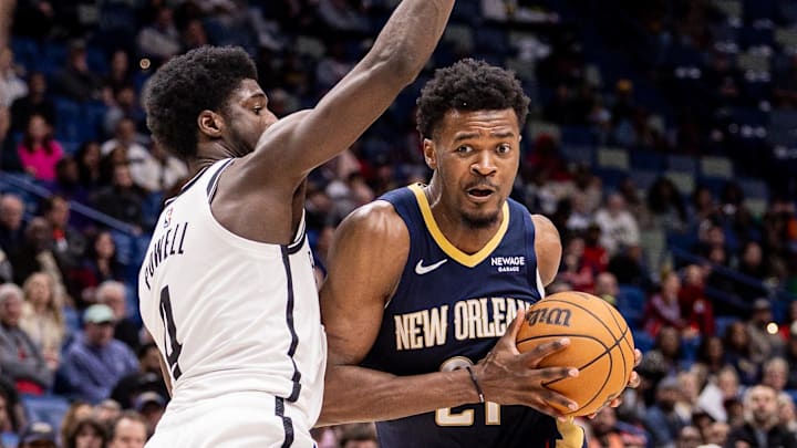 Jan 14, 2026; New Orleans, Louisiana, USA;  New Orleans Pelicans center Yves Missi (21) dribbles against Brooklyn Nets guard/forward Drake Powell (4) during the second half at Smoothie King Center. Mandatory Credit: Stephen Lew-Imagn Images