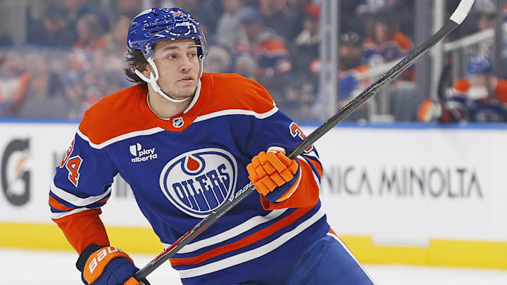 Mar 6, 2026; Edmonton, Alberta, CAN; Edmonton Oilers forward Colton Dach (34) looks for a loose puck during the first period in his first game for the Edmonton Oilers against the Carolina Hurricanes at Rogers Place. Mandatory Credit: Perry Nelson-Imagn Images