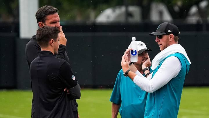 Jacksonville Jaguars head coach Liam Coen, right, talks with General Manager of the Jacksonville Jaguars James Gladstone, left and executive vice president of football operations Tony Boselli after the second day of minicamp at the Miller Electric Center, Wednesday, June 10, 2026, in Jacksonville. [Doug Engle/Florida Times-Union]