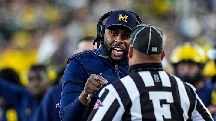 Michigan head coach Sherrone Moore talks to a referee and challenges an incomplete pass intended for tight end Colston Loveland (not in the photo) during the second half against Oregon at Michigan Stadium in Ann Arbor on Saturday, Nov. 2, 2024.