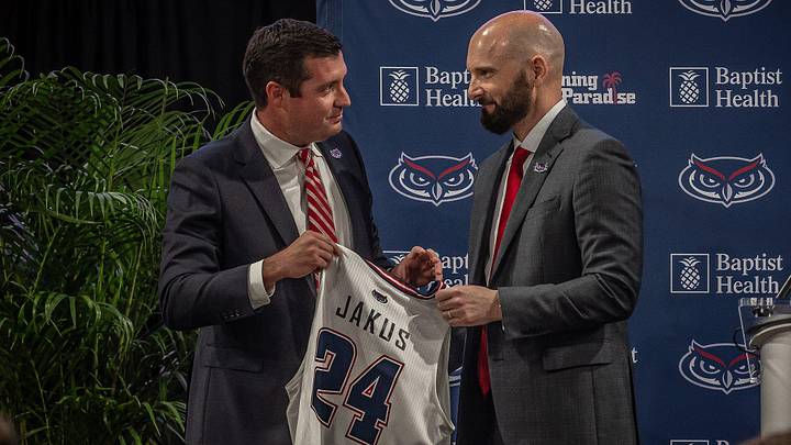 Brian White, Florida Atlantic University Vice President and Director of Athletics, stands with new head men's basketball coach John Jakus during an FAU press conference at Eleanor R. Baldwin Arena on campus in Boca Raton, Fla., on March 29, 2024. Brian White, Florida Atlantic University Vice President and Director of Athletics, stands with new head men's basketball coach John Jakus during an FAU press conference at Eleanor R. Baldwin Arena on campus in Boca Raton, Fla., on March 29, 2024.
