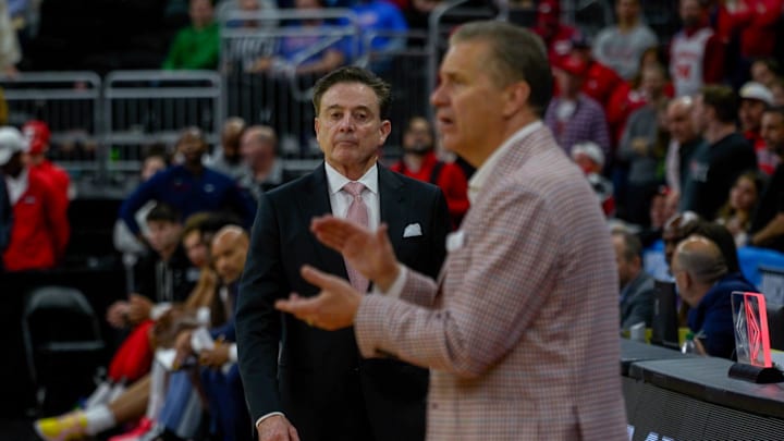 St. John's basketball head coach Rick Pitino, left, approaches Coach John Calipari as their March Madness game is about to end on Saturday.