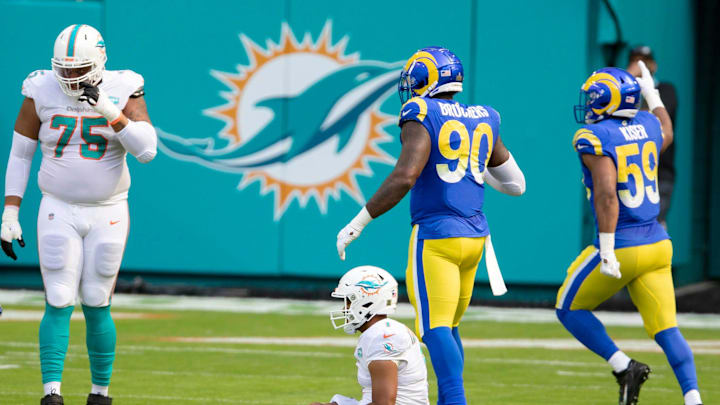 Miami Dolphins quarterback Tua Tagovailoa (1) sits on field after being stripped of the ball on the first series of downs against the Los Angeles Rams at Hard Rock Stadium in Miami Gardens, November 1, 2020.  (ALLEN EYESTONE / THE PALM BEACH POST)