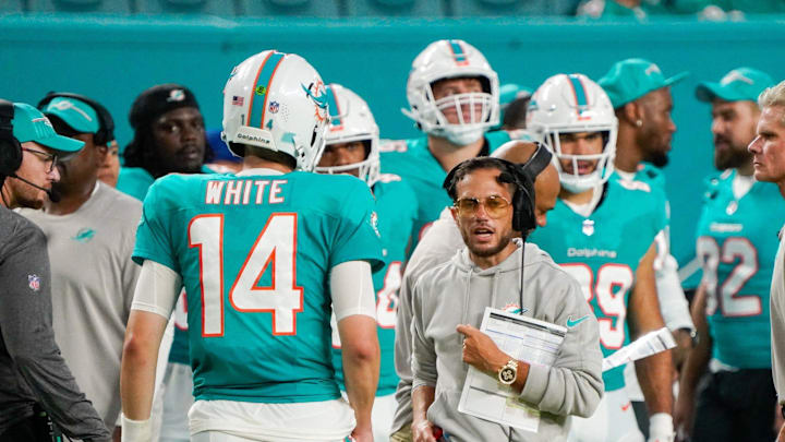 Miami Dolphins head coach Mike McDaniel and quarterback Mike White (14) during a preseason game at