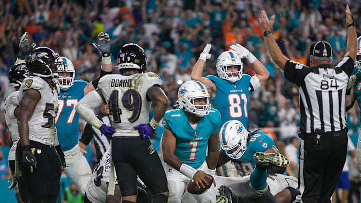 Miami Dolphins quarterback Tua Tagovailoa (1), scores a running touchdown late in the fourth quarter against the Baltimore Ravens during NFL game at Hard Rock Stadium Thursday in Miami Gardens.