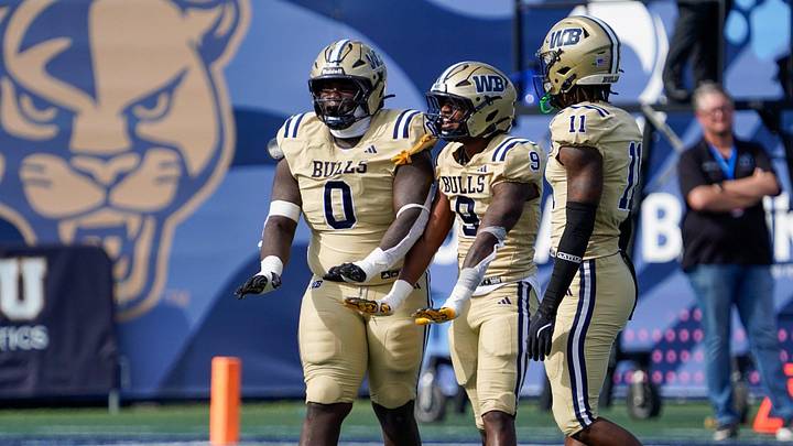 West Boca defenders Jamar Thompson (0), Grant Edmond (9), and Demetrius Geathers Jr. (11) celebrate a sack against West Broward in the second quarter of the 6A State Final at Pitbull Stadium on Dec. 12, 2025, in Miami, FL. West Boca defenders Jamar Thompson (0), Grant Edmond (9), and Demetrius Geathers Jr. (11) celebrate a sack against West Broward in the second quarter of the 6A State Final at Pitbull Stadium on Dec. 12, 2025, in Miami, FL.