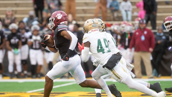 Louisville's Zaiden Jernigan (8) runs over 90 yards for a touchdown against Poplarville during the MHSAA 4A championship game in Hattiesburg, Miss., Saturday, Dec. 7, 2024.