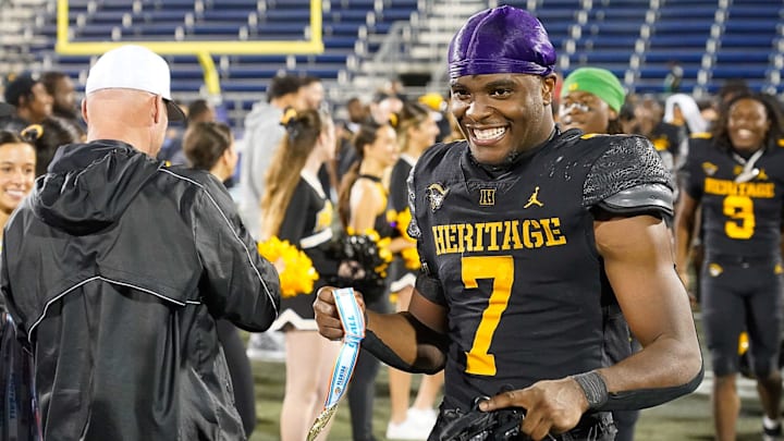 American Heritage Patriots running back Byron Louis (7) receives his medallion after defeating the Jones Tigers 40-31 in the FHSAA Class 4A Football Championship on Friday, December 13, 2024 in Miami, Florida. Jeff Romance/Special to the USA Today Florida Network