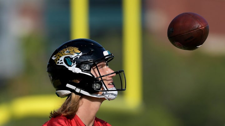 Jacksonville Jaguars quarterback Trevor Lawrence (16) watches the ball as he bounces it off his foot between drills on the fifth day of the NFL football training camp practice session Monday, July 29, 2024 at EverBank Stadium's Miller Electric Center in Jacksonville, Fla..