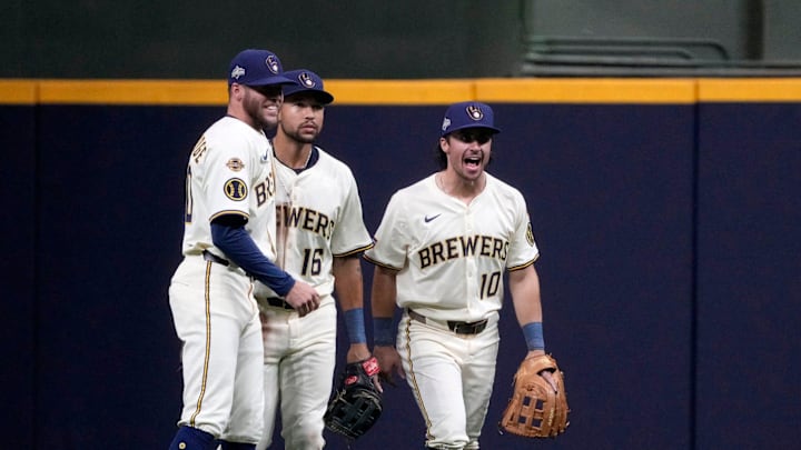 Milwaukee Brewers left fielder Brandon Lockridge (20), Milwaukee Brewers center fielder Blake Perkins (16) and Milwaukee Brewers right fielder Sal Frelick (10) celebrate the final out after beating the Chicago Cubs 7-3 during the National League Division Series game at American Family Field in Milwaukee, Wisconsin on Oct. 6, 2025.
